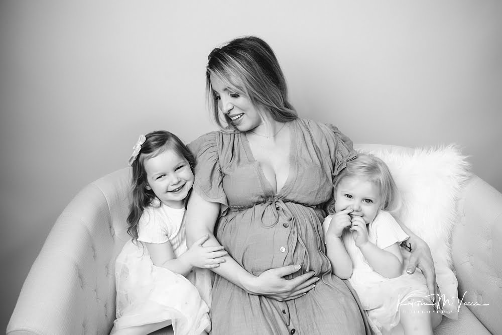 Studio family maternity photos by The Flash Lady Photography.