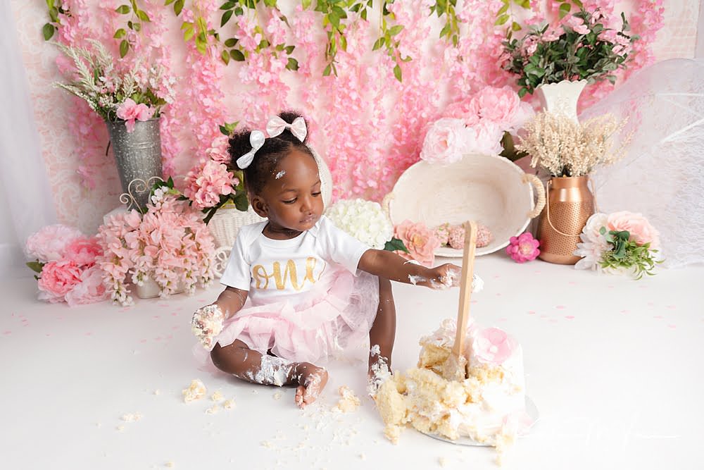 Pink floral smash of cake by The Flash Lady Photography