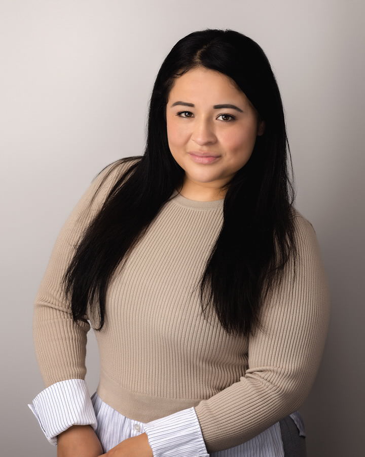 Hispanic curvy woman posing for her professional modeling headshot by The Flash Lady Photography