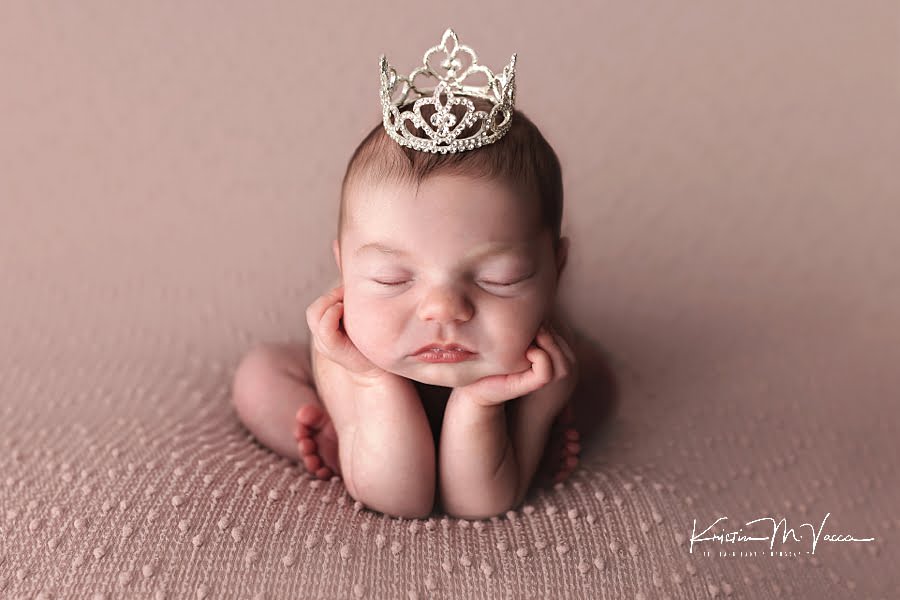Froggie pose of a baby girl on a mauve blanket during her summer newborn photos
