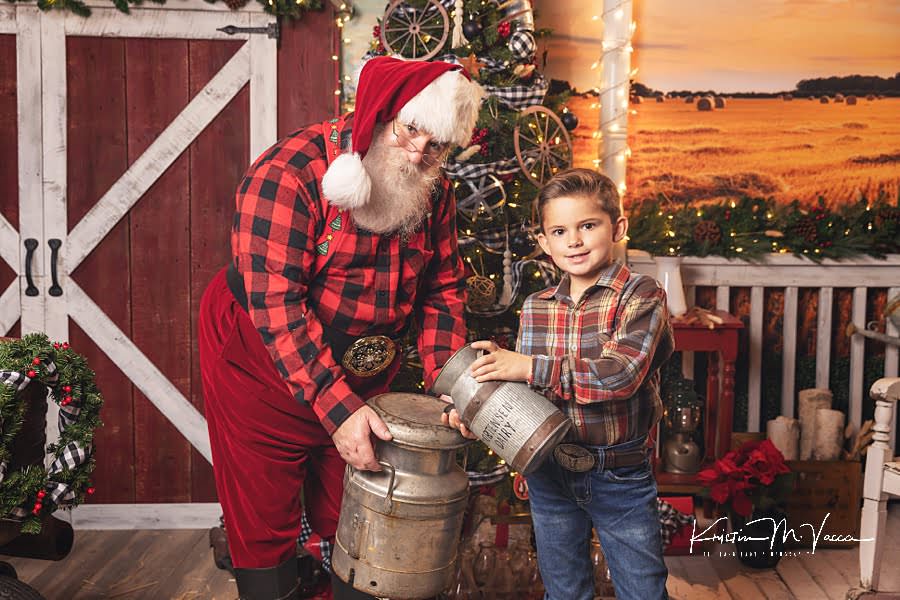 Young boy pretends to pour milk with Santa Claus during Christmas photos 2022